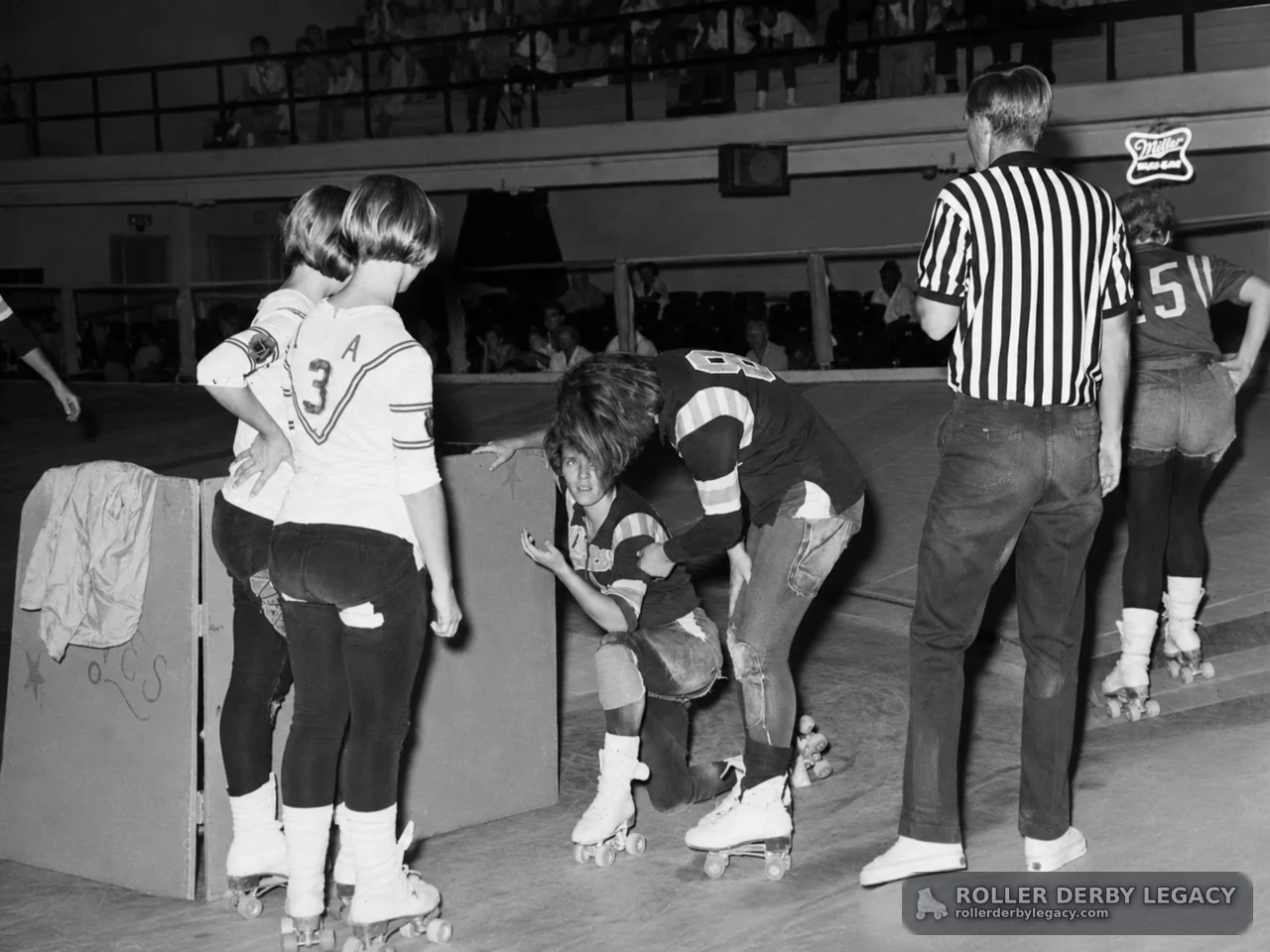 Trackside Pause During an Indoor Roller Derby Bout