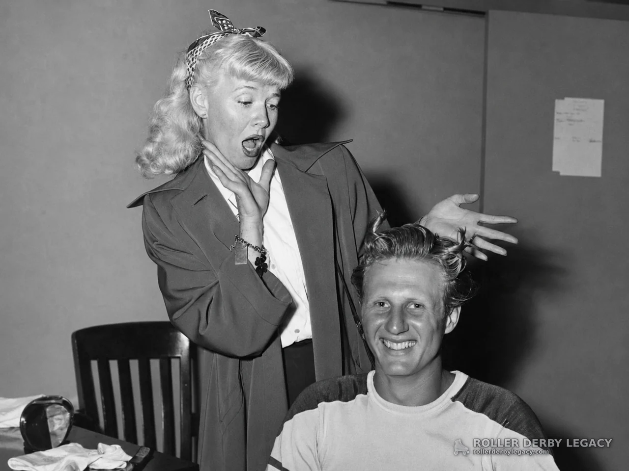 Woman Reacts Beside Smiling Man in Indoor Portrait