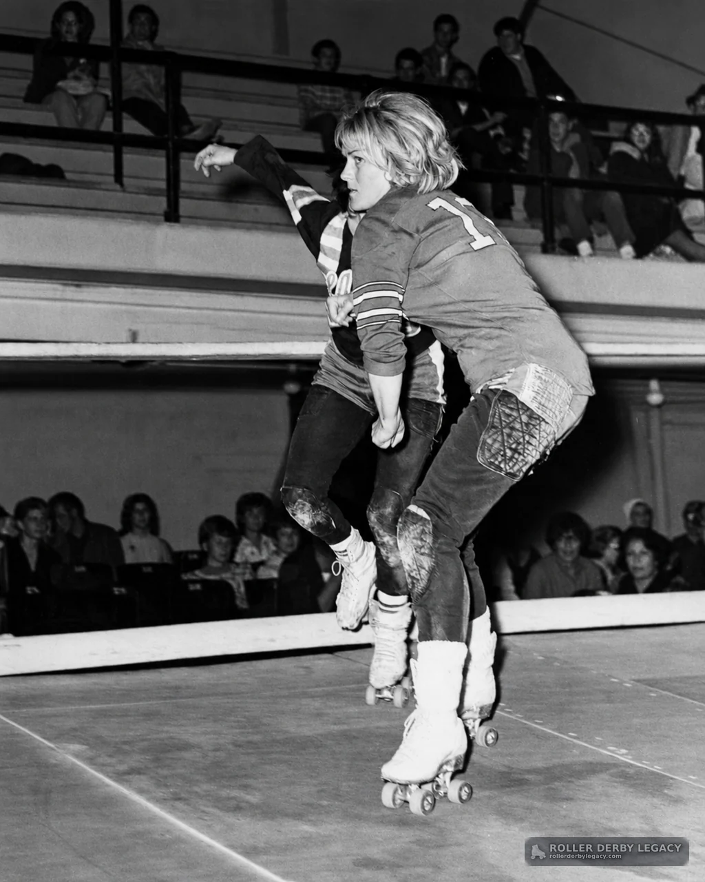 Roller Derby Skaters in Contact at an Indoor Rink