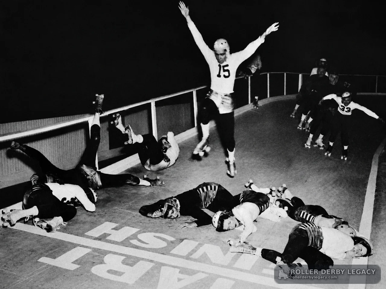 Number 15 Leaps Over Fallen Roller Derby Skaters
