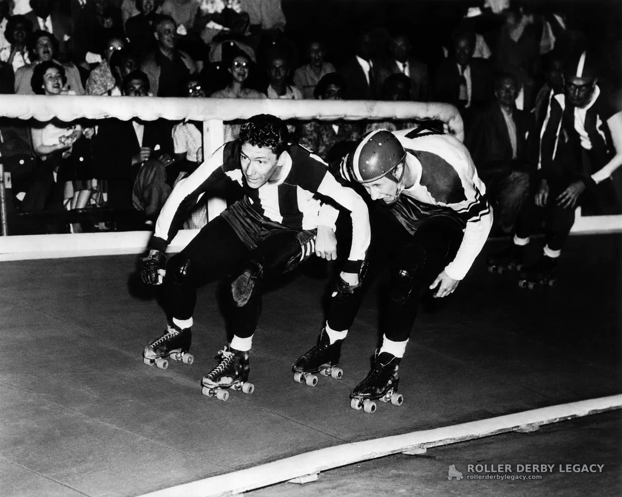 Roller Derby Skaters Rounding a Banked Track