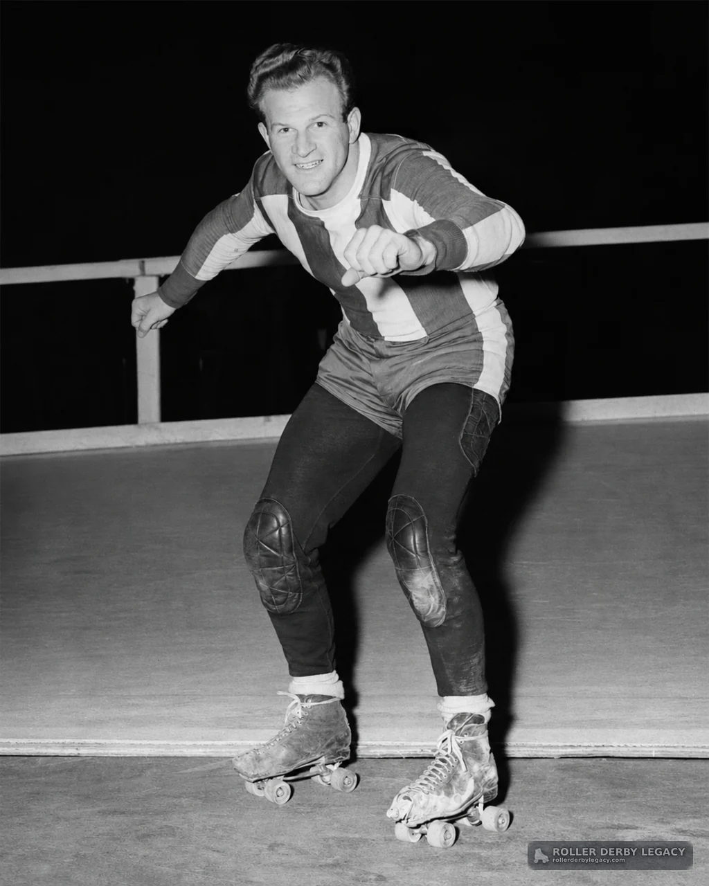 Skater in Striped Uniform on Rink