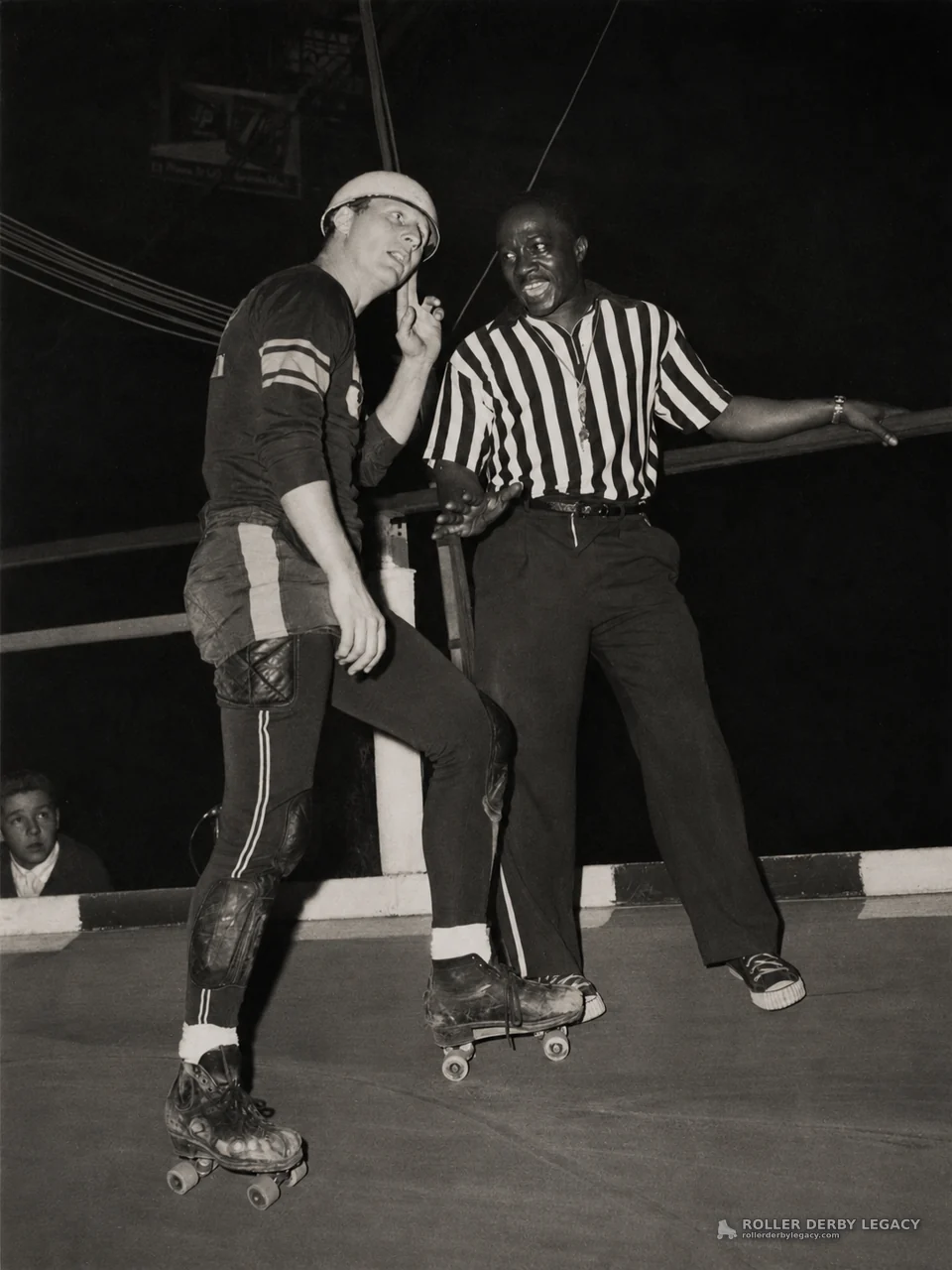 Roller Skater Confers with Track Official