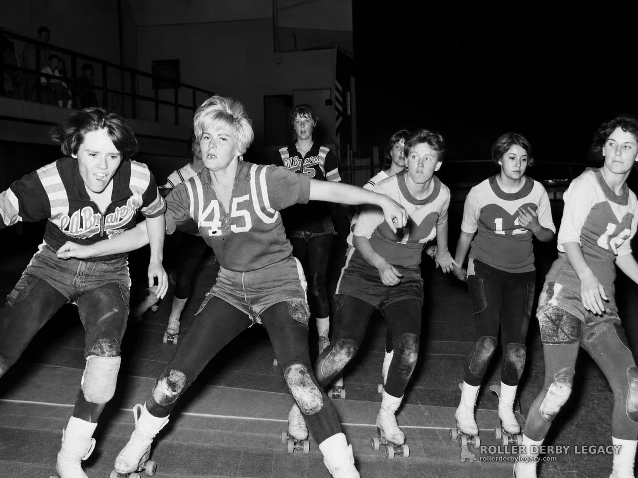 Skaters in Old Braves Jerseys on an Indoor Track