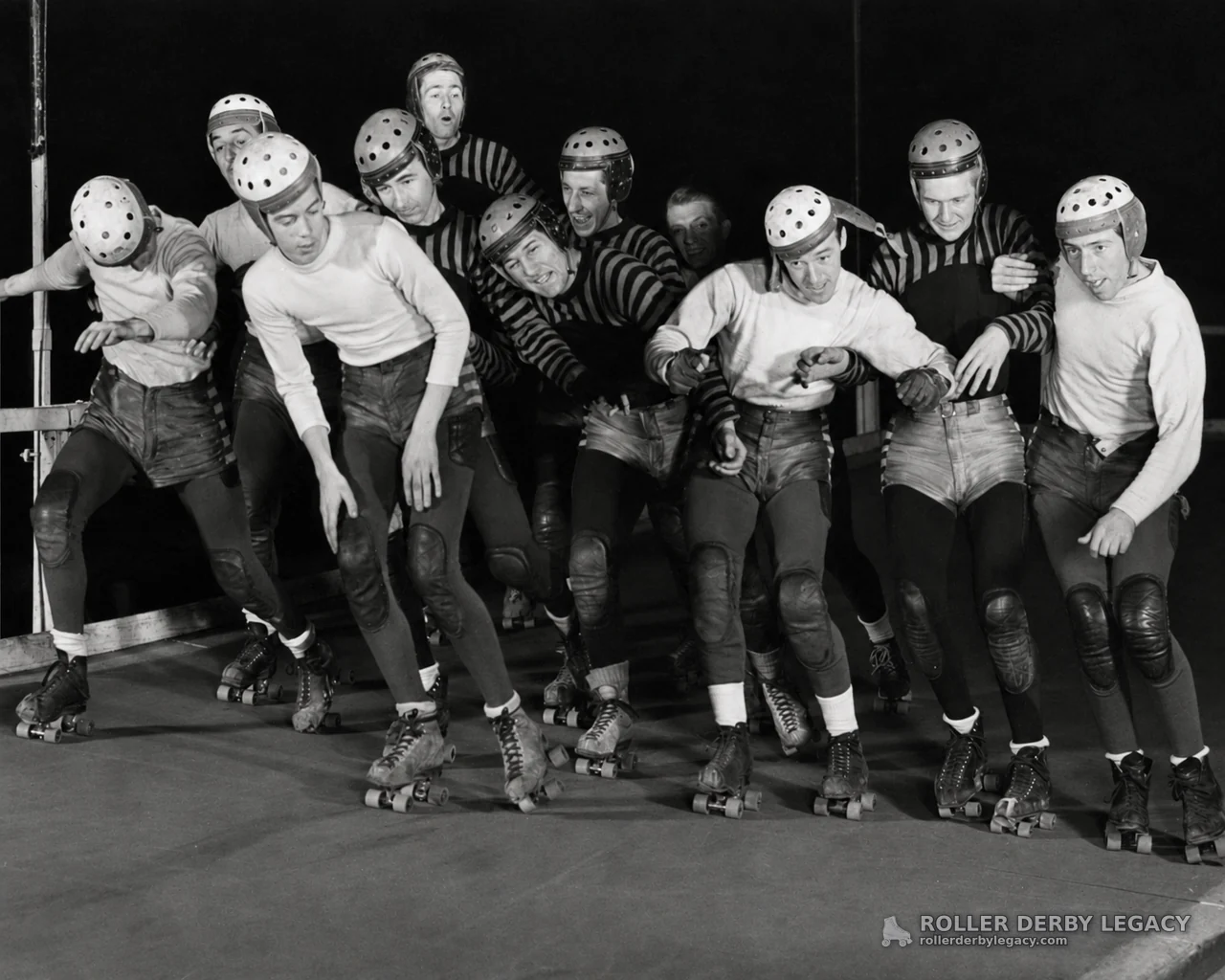 Helmeted Roller Derby Skaters Packed on the Track