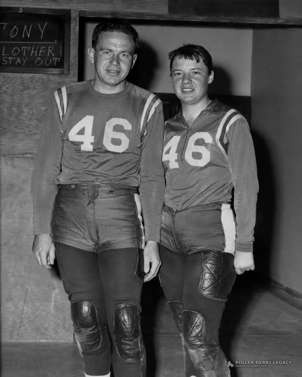 Two Athletes in Number 46 Uniforms Beside Chalkboard
