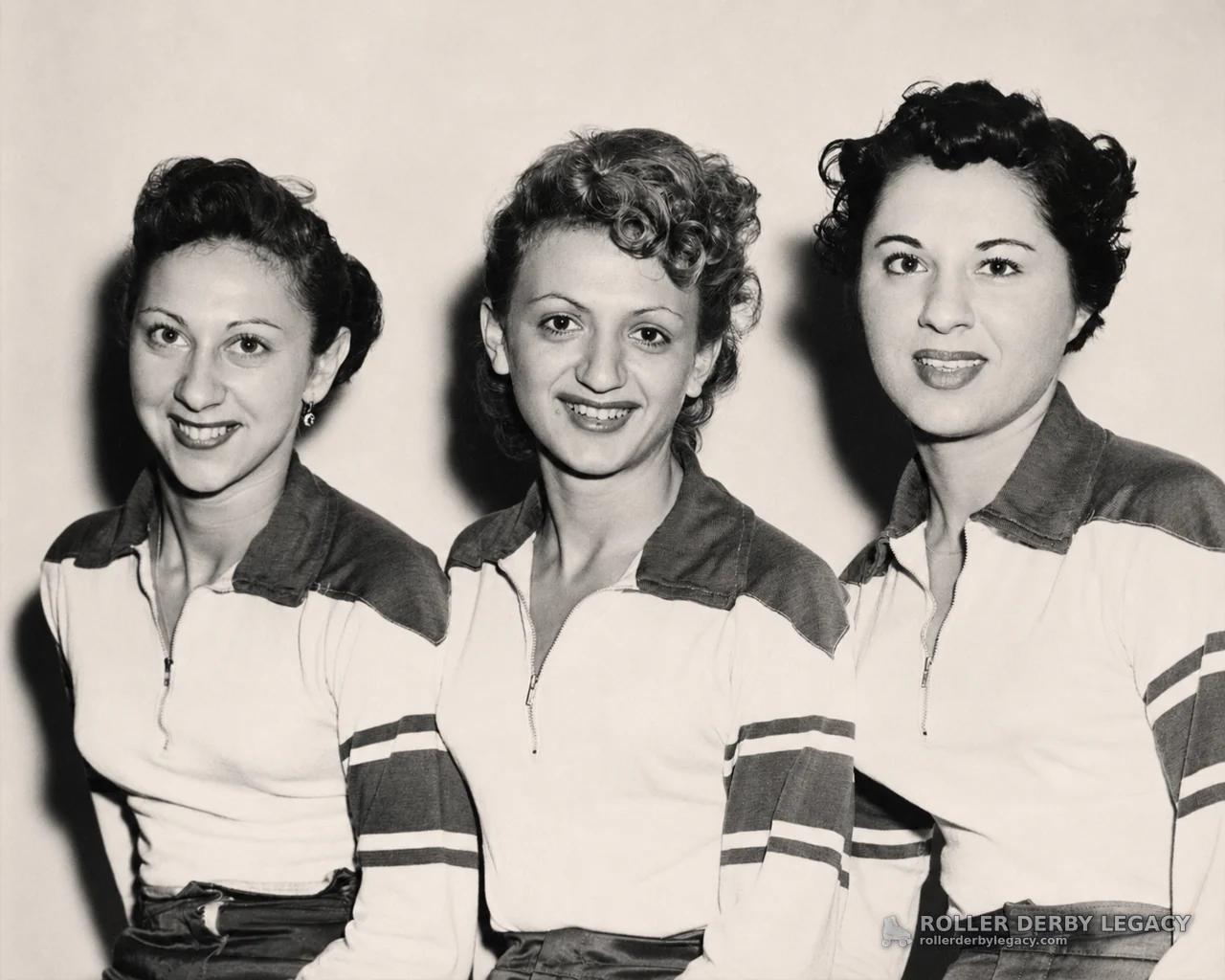 Three Women in Matching Zip-Collar Athletic Tops
