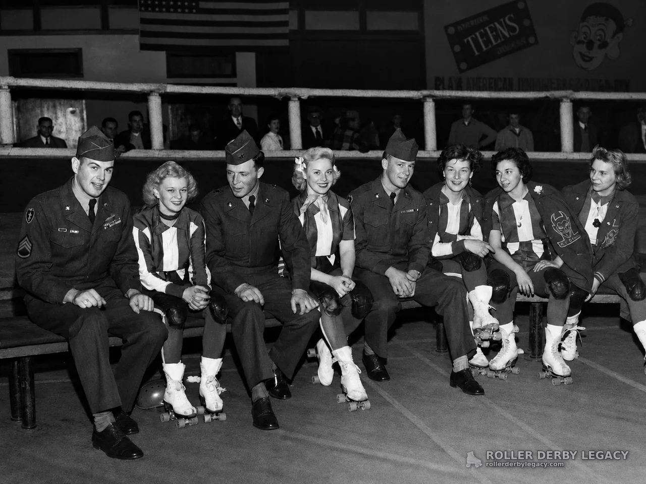Military Servicemen and Women Skaters Seated at an Indoor Rink
