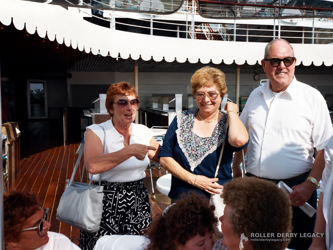 Group on a Sunlit Ship Deck