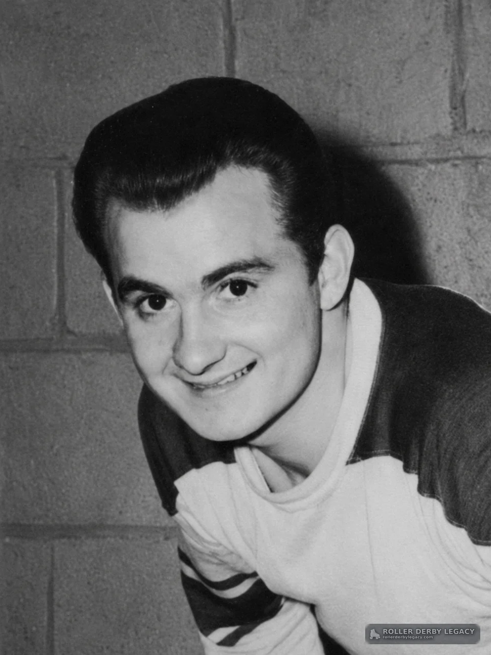 Smiling Young Man in Sports-Style Shirt