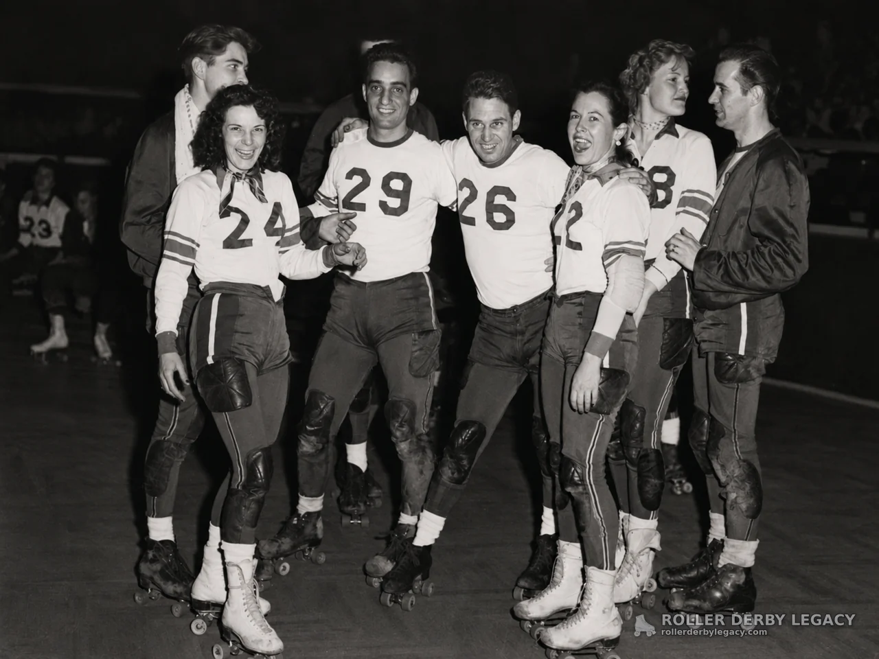 Roller Skaters in Numbered Jerseys on an Indoor Rink
