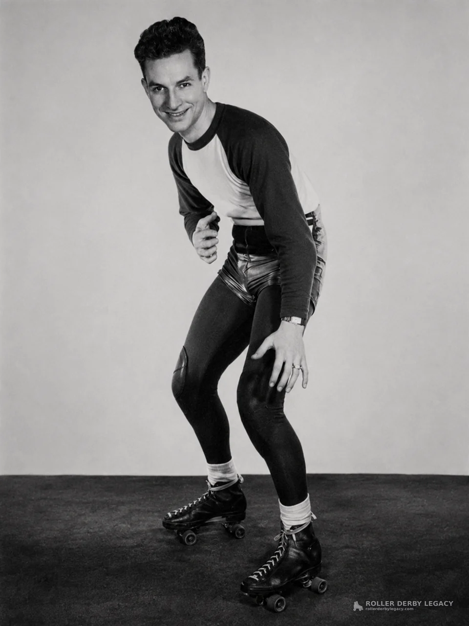 Studio Portrait of a Roller Skater in Crouched Stance