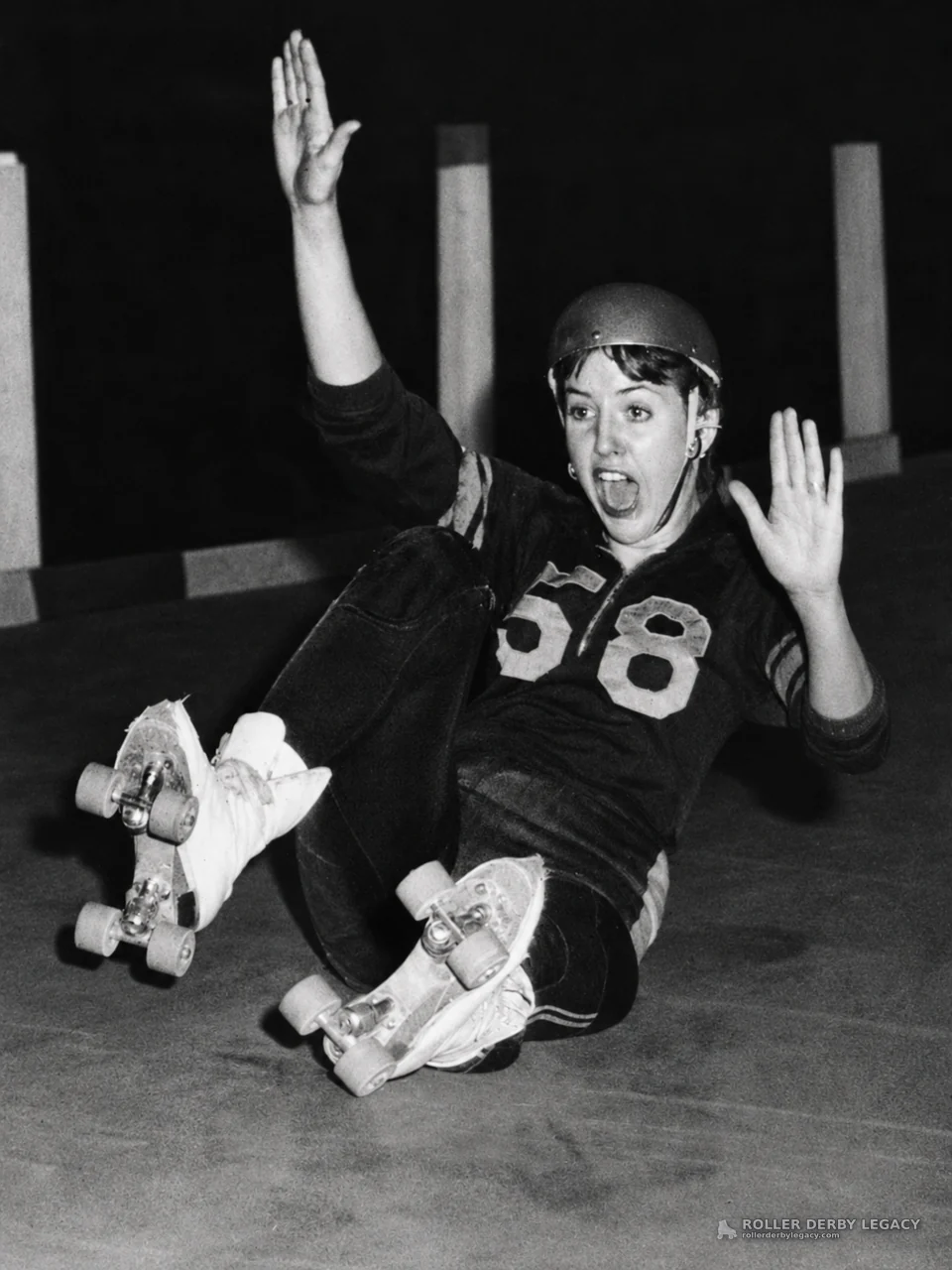 Skater in Number 58 Jersey Down on Indoor Track