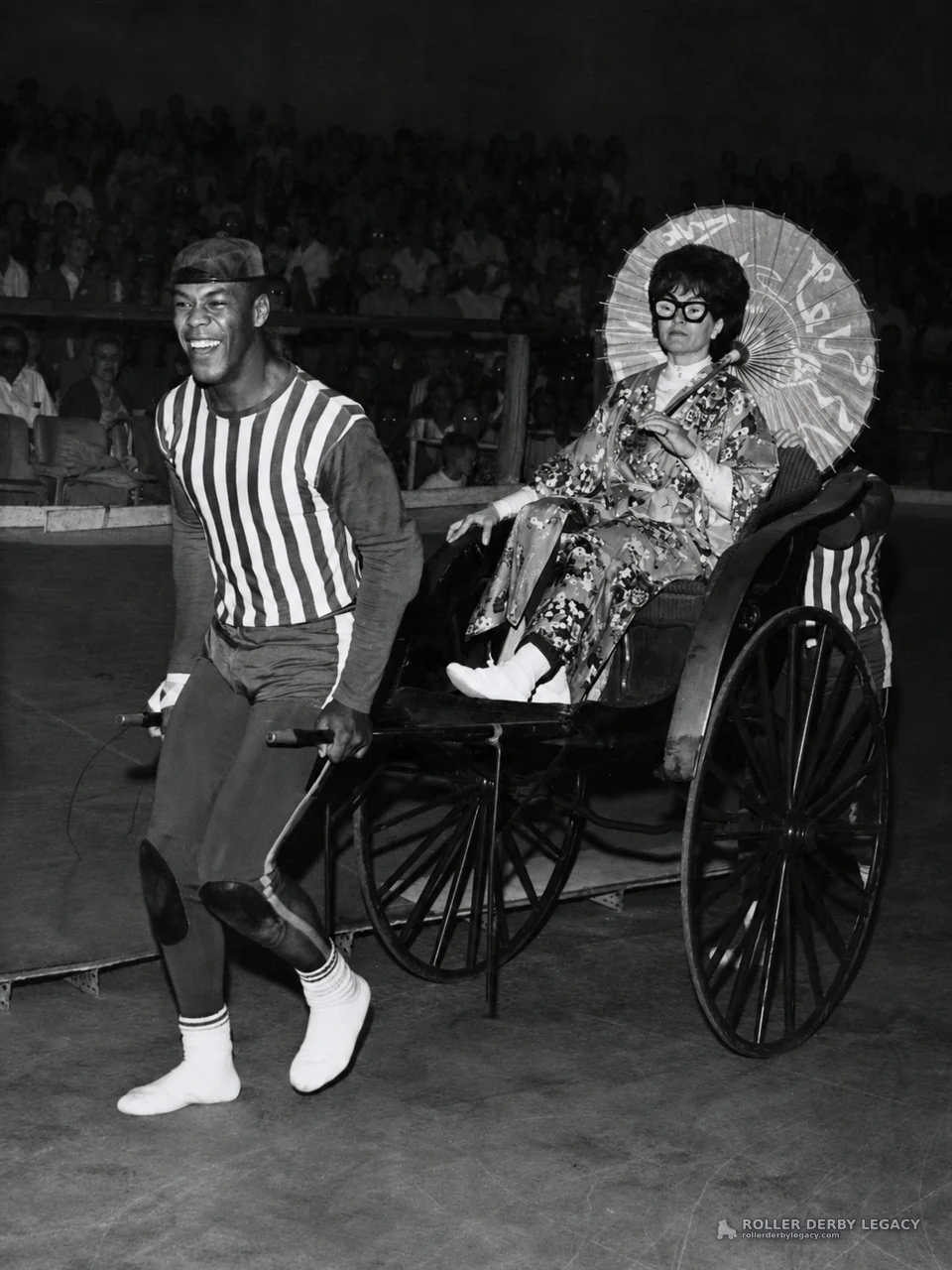 Costumed Rickshaw Entrance in an Indoor Arena