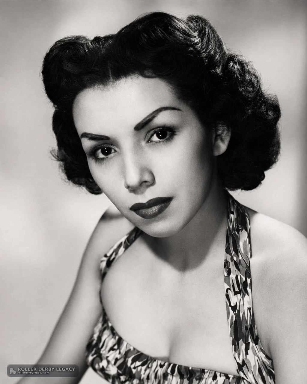Black-and-White Studio Portrait of Woman in Patterned Halter Top