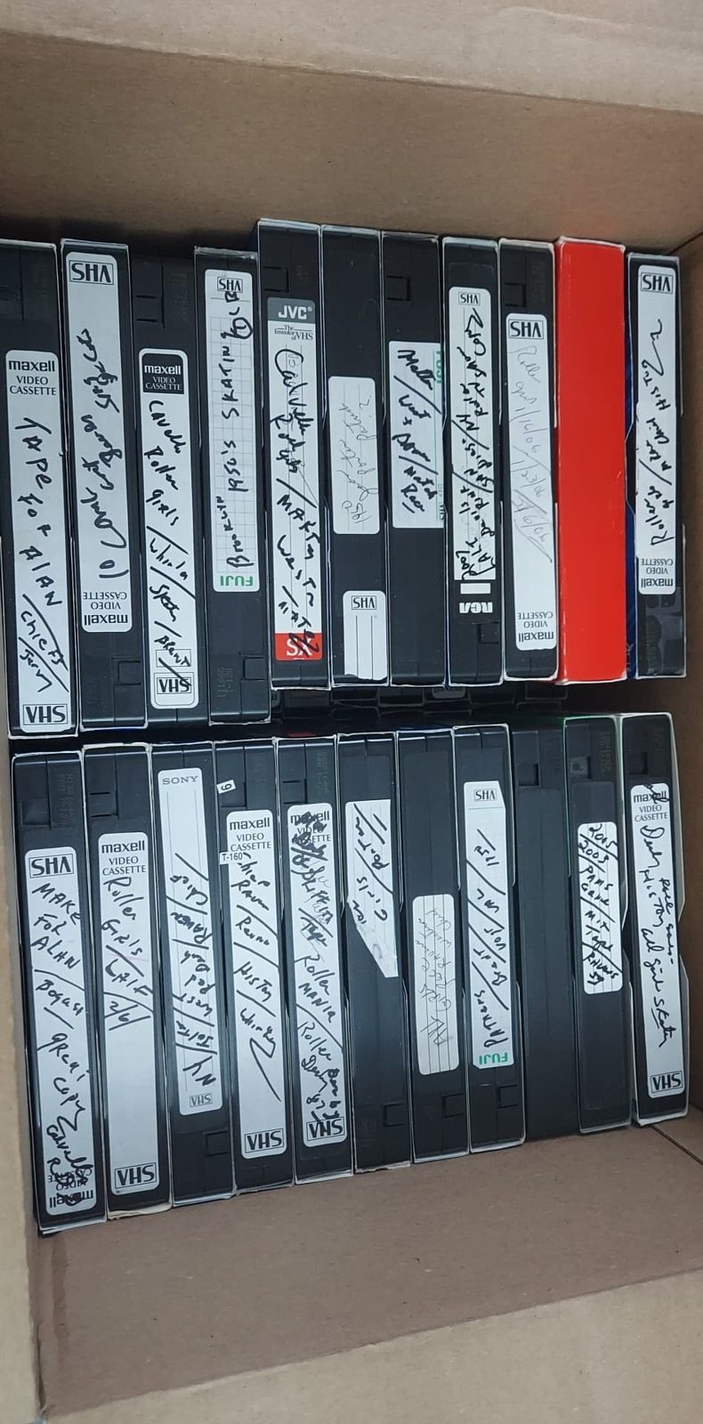Rows of labeled VHS tapes preserved from the collection.