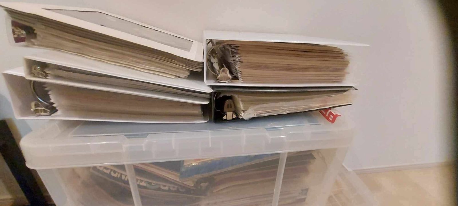 A storage tub filled with envelopes and folders of original collection documents.